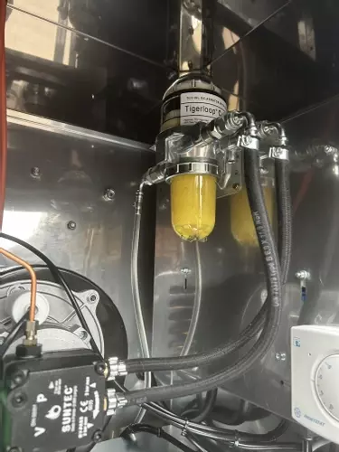 Tiger Loop fuel system installed with new fuel feed on a Nilfisk 400HS DTE pressure washer. Removes air from the fuel line, stabilises fuel delivery, and improves burner efficiency and reliability.